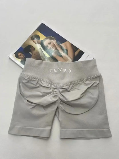 TEVEO Short De Yoga Femme Extensible Respirant Pêche Hanche Hanche Fitness Short de Course Hanche Haute Stretch Mèches De Sueur