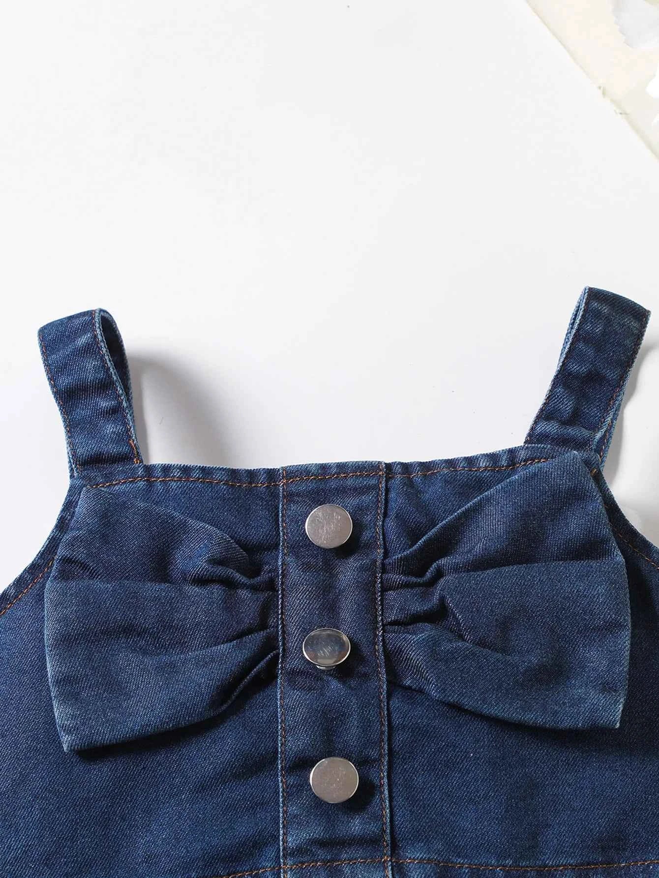The girl-loved denim pleated skirt set features a bow blouse with an attached belt.