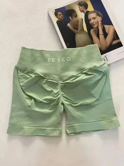 TEVEO Short De Yoga Femme Extensible Respirant Pêche Hanche Hanche Fitness Short de Course Hanche Haute Stretch Mèches De Sueur